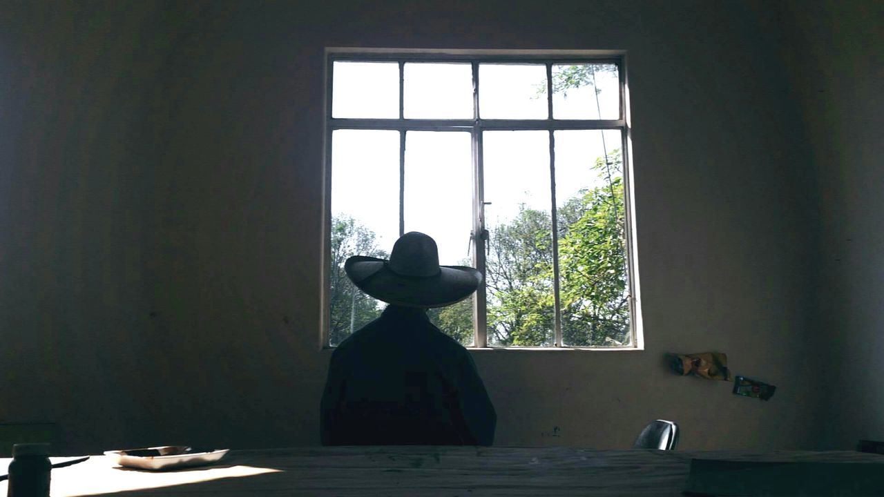 CLOSE-UP OF WINDOW ON TABLE AGAINST THE WALL