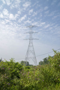 Low angle view of electricity pylon against sky