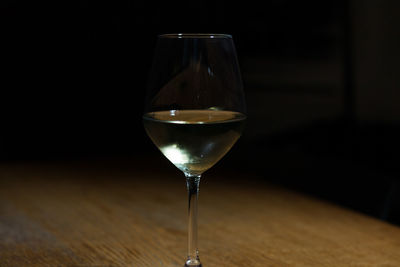 Close-up of wine in glass on table