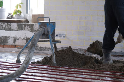 Low section of man standing on steps