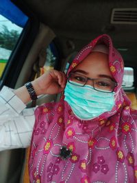 Portrait of girl in car