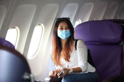 Woman sitting in bus