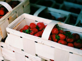 High angle view of strawberries in crate at market