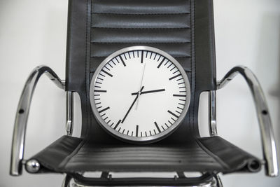 Close-up of clock on table