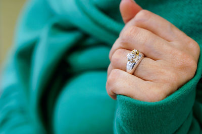 Cropped hand of woman with wedding ring