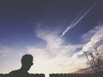 Low angle view of people against sky