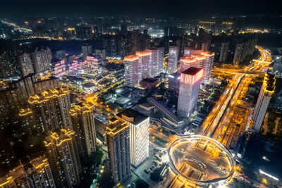 High angle view of illuminated cityscape at night