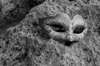 Close-up of mask on rock