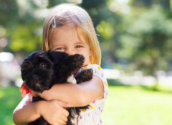 Portrait of cute girl with dog