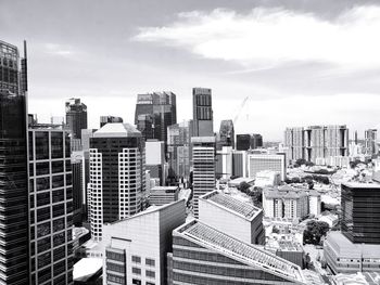 High angle view of buildings in city against sky
