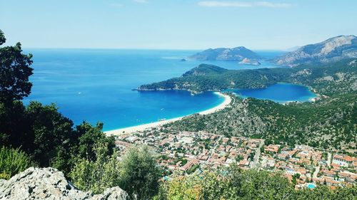 Scenic view of sea and landscape against sky