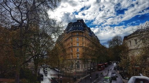 Buildings against cloudy sky