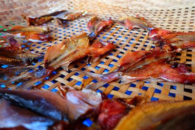 High angle view of fish on barbecue grill