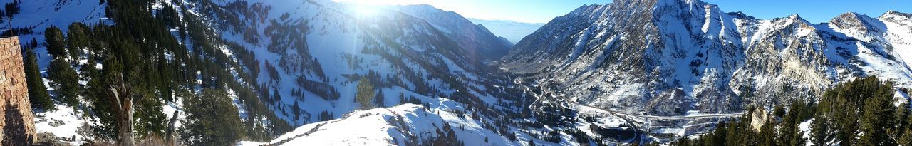 Scenic view of snow covered mountains against sky