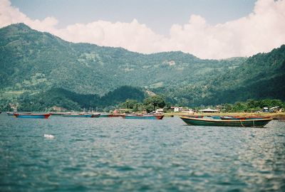 Scenic view of lake against cloudy sky