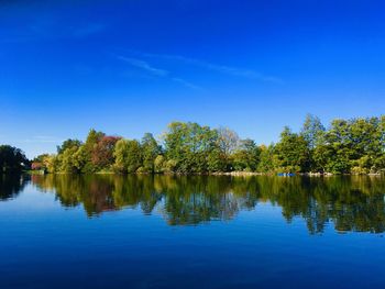 Scenic view of lake against blue sky