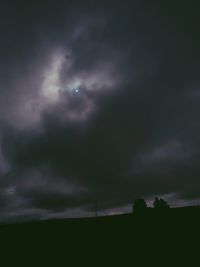 Low angle view of storm clouds at night