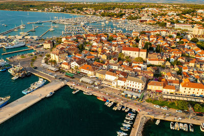 High angle view of townscape by sea