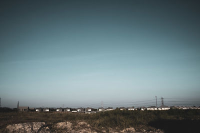 Scenic view of field against clear sky