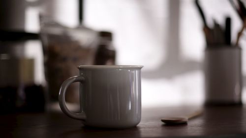 Close-up of coffee cup on table