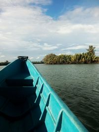 Close-up of boat in sea against sky