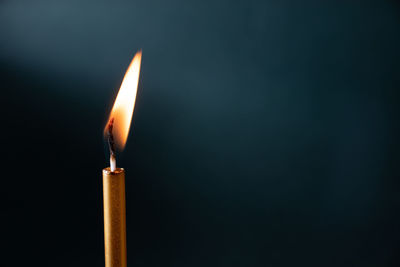 Close-up of illuminated lamp against black background