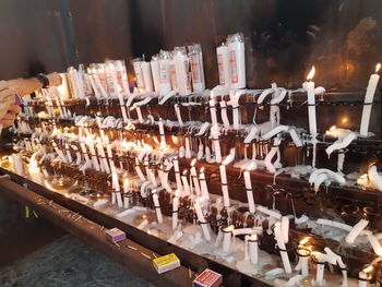 Panoramic view of candles in temple