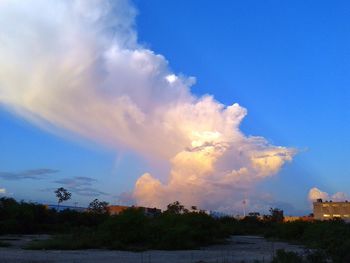 Scenic view of landscape against cloudy sky