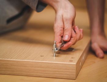 Cropped hands of man working in workshop