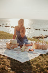 Woman sitting on beach