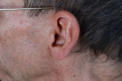 Cropped image of man ear