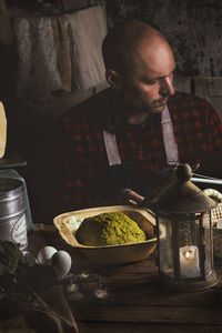 Young man preparing food at home