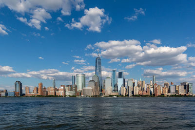 Modern buildings in city against sky