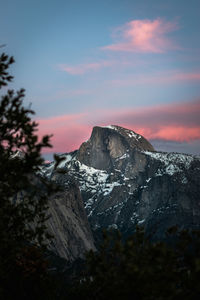 Scenic view of snowcapped mountains against sky during sunset