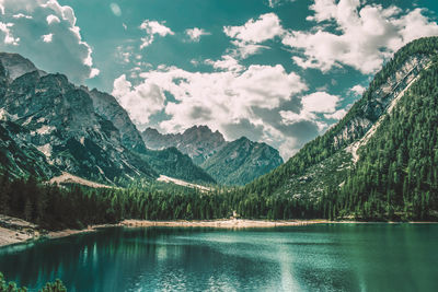 Scenic view of lake and mountains against sky