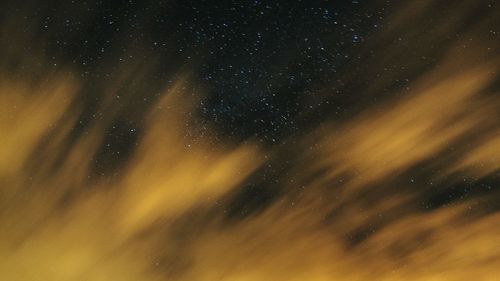 Low angle view of star field against sky