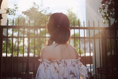 Rear view of girl looking at trees