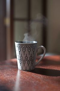 Close-up of coffee cup on table