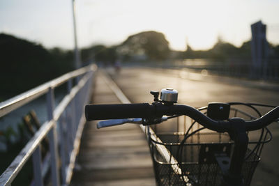 Close-up of bicycle on bridge