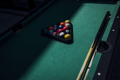 Cropped hand playing pool