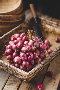 High angle view of strawberries in basket on table