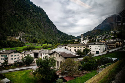 Buildings in town against sky