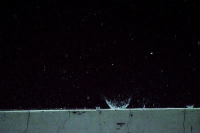 Close-up of illuminated star against sky at night