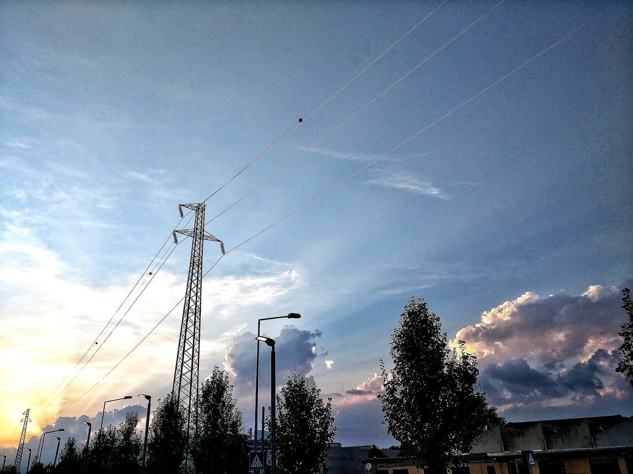 LOW ANGLE VIEW OF VAPOR TRAILS IN SKY