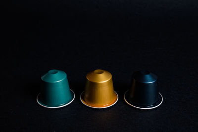 High angle view of glasses against black background