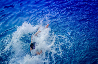 High angle view of man swimming in pool