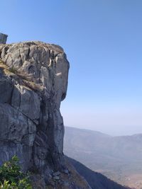 Scenic view of mountains against clear blue sky