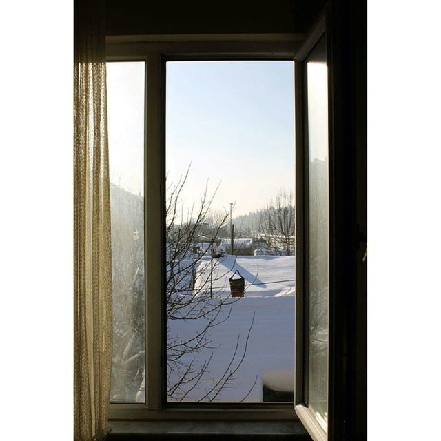 window, indoors, water, glass - material, snow, built structure, transparent, winter, architecture, cold temperature, clear sky, house, day, sky, reflection, door, nature, no people, sea, looking through window