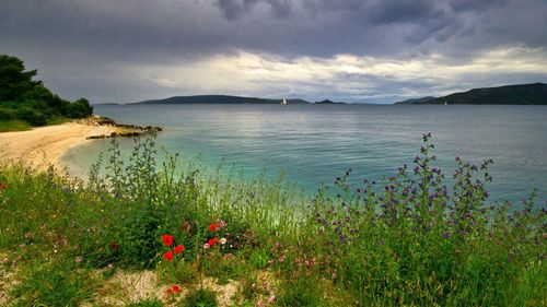 Scenic view of sea against cloudy sky