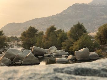 Rocks on land against sky
